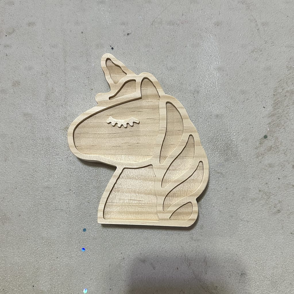Unpainted wooden unicorn silhouette, ready for decorating.