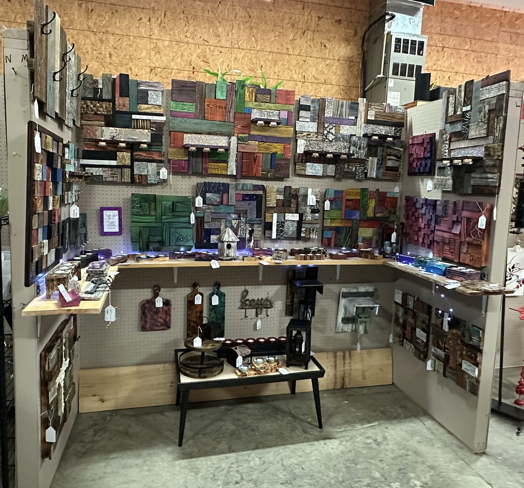 Handmade art pieces on display in the Mcatz Creations booth.