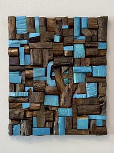 Chunky Murphy Mosaic reclaimed wood wall art with a tree shape and blue stained blocks on a natural wood background.